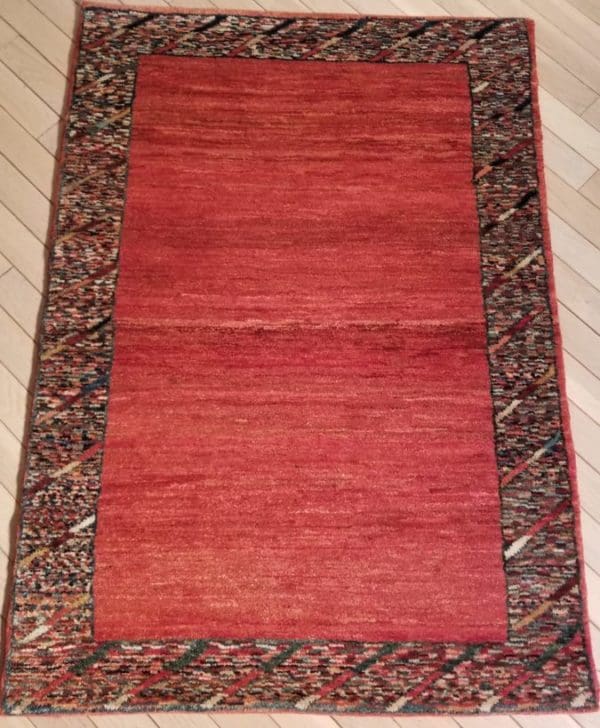 Image of Persain Gabbeh Rug - Madder Field With Speckled Border